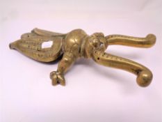 A brass beetle boot jack
