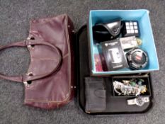 A tray containing a leather hand bag, pair of sunglasses, Nokia mobile phone,
