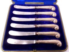 A cased set of six silver handled butter knives