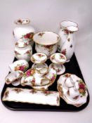 A tray containing sixteen pieces of Old Country Roses china including a pair of candlesticks,