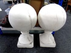 A pair of concrete ball finials.