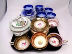 A tray containing continental blue and white teacups and saucer,