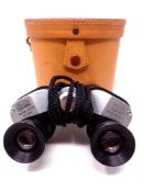 A pair of Oxley field glasses in leather case together with a Hohner super chromonica in box.