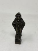 A Victorian brass seal modelled as a clown, height 8 cm.