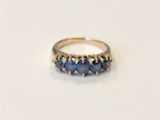A gold sapphire five stone ring, size L CONDITION REPORT: 4.7g, apparently unmarked.