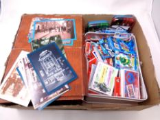 A box containing a large quantity of contemporary postcards,