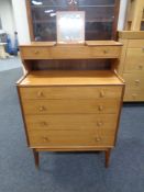 A mid 20th century teak vanity chest