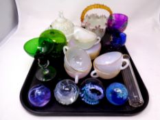 A tray containing silver lidded glass scent bottle, glass paperweights including Caithness,