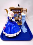 A tray containing Ringtons Millennium Celebration teapot number 5905/7500 with certificate together