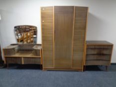 A mid 20th century teak effect four piece bedroom suite