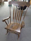 A beech spindle back rocking chair