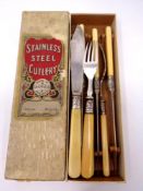 A stainless steel fish knife and fork set with silver ferrules