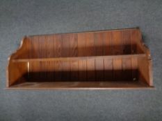 A pine two-tier wall shelf