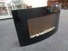 A wall mounted electric fire