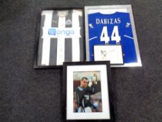 A framed Newcastle United signed football shirt,