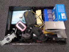 A crate of assorted digital cameras,