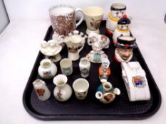 A tray of ceramics, Goss crested china, Doulton beafeater character jug, Goebel mug,