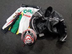 A Suomy motorcycle helmet together with a Honda licence product jacket bearing advertising and an
