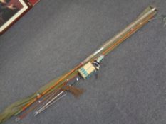 A box of three fishing bags, landing net, Penn reel in box,