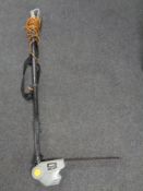 A Titan electric hedge trimmer,