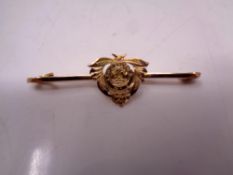 A 9ct gold sweetheart brooch