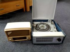 A mid century Philips portable electric record player together with a Bakelite cased Defiant radio