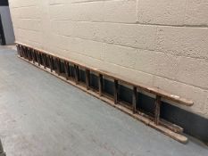 A wooden extension ladder