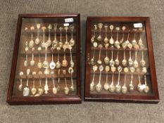 Two glazed wall-hanging display cabinets,