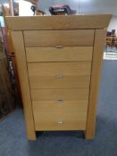 A contemporary oak four drawer chest