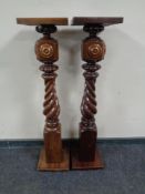 A pair of stained beech barley twist jardiniere stands