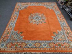 A 20th century fringed woolen carpet of geometric design retailed by Robson and Sons Newcastle upon