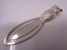 A silver owl book mark