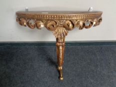 A D-shaped gilt hall table