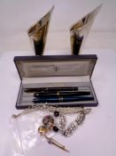 A pair of silver plated flower holders,