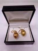 A pair of silver gilt drop earrings