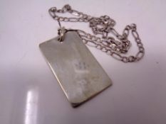 A silver ingot on chain