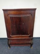 A continental mahogany cabinet (locked)