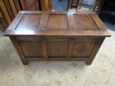 A carved oak blanket box