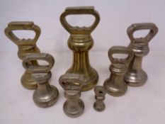 A set of seven 19th century graduated brass weights