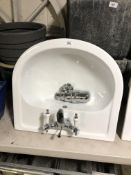 A Vogue wall mounted sink with mixer tap