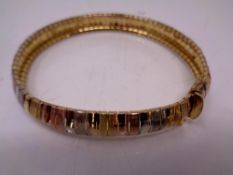 A silver multi coloured bangle