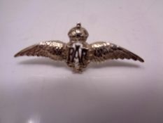 A silver RAF cap badge