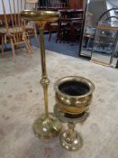 A 19th century brass plant stand together with brass trivet and planter on paw feet