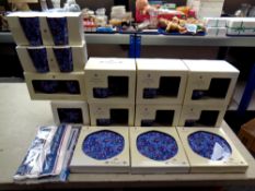 Thirteen boxed pieces of Ringtons chintz tea ware together with matching luxury tea towels