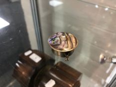 A pearl shell pill box