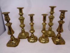 Three pairs of Victorian brass candlesticks