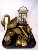 A tray of brass wares, swan planter, onyx and brass lighter, rocking horse,