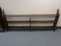 A set of early twentieth century oak open shelves