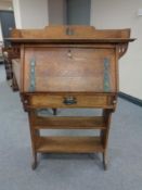 An oak Arts and Craft lady's bureau