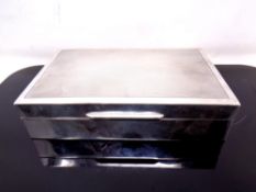 A silver cigarette case, Birmingham marks, width 14.5 cm.